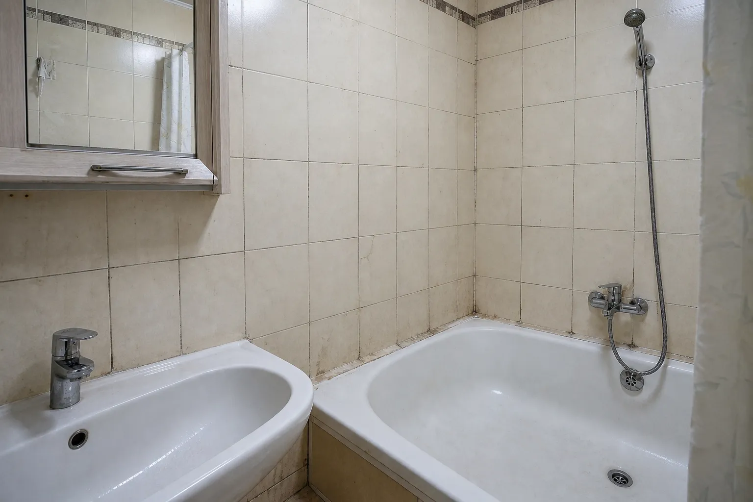 Bathroom with mold on tile grout — before